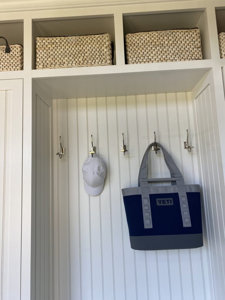 Simple mudroom hook wall with a ball cap and tote bag ready for grab-and-go mornings