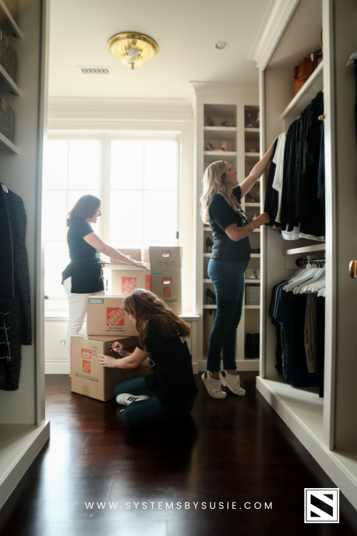 Three Professional Organizers Packing and Labeling Moving Boxes. Moving Tip: Wear an apron with your supplies for the day!