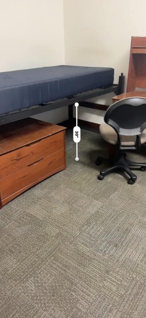 Dorm room bed showing measurement for height