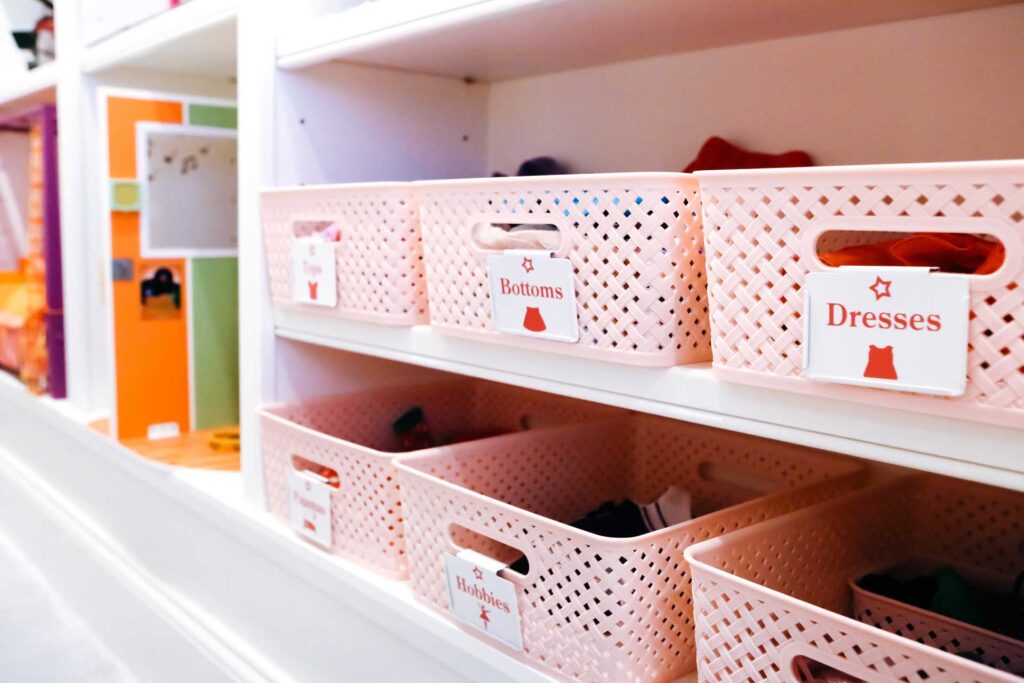 Baskets of toys in a child's playroom after decluttering