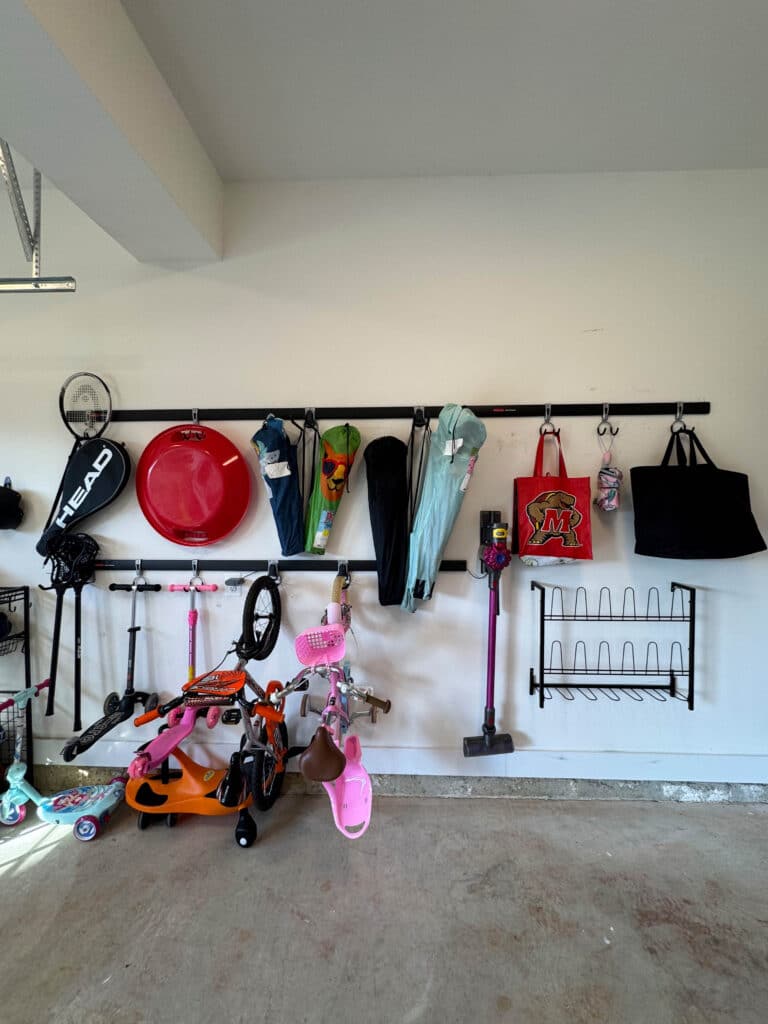 Track system moves things from the floor to the wall in an organized garage