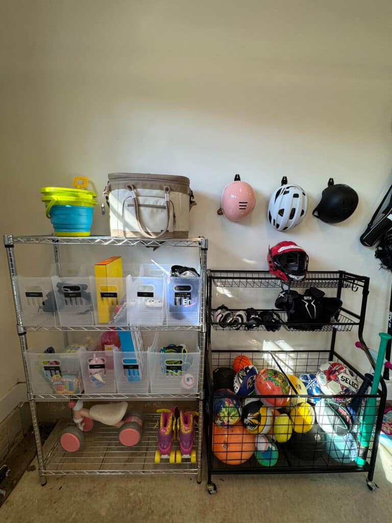 Shelves and hooks move things off the floor in an organized garage