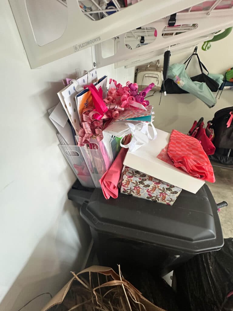Unorganized gift wrapping supplies in the garage