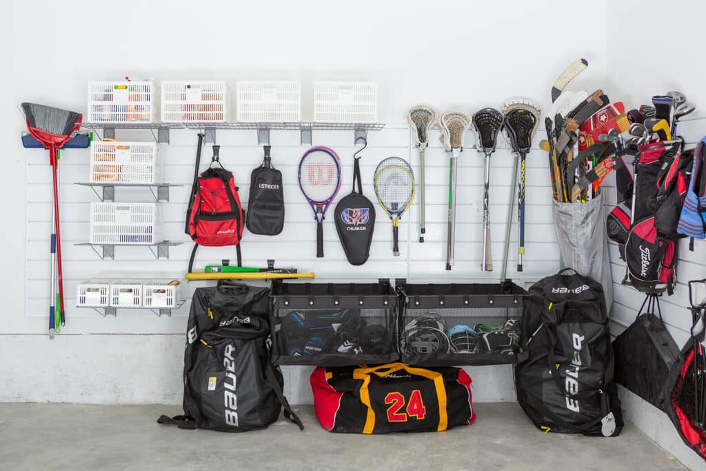 Track systems and hooks can help get things off the floor for an organized garage