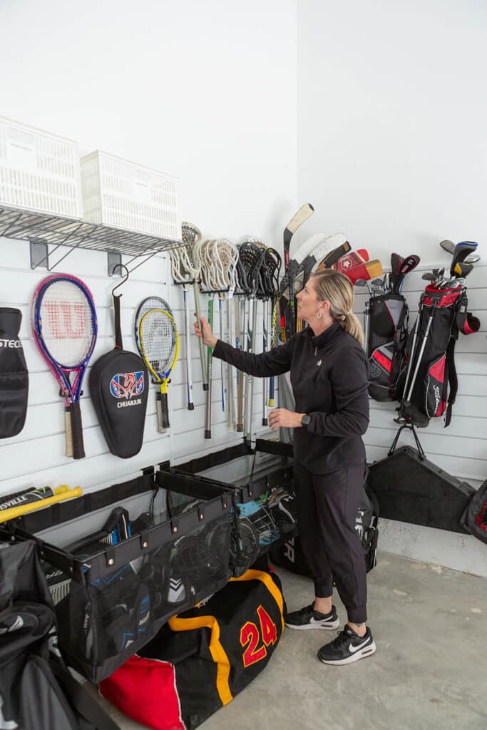 Track systems and hooks can help get things off the floor for an organized garage