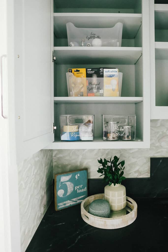 Laundry room cabinet with bins