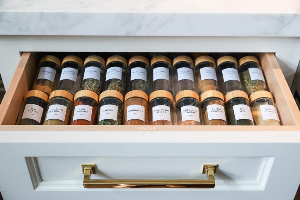 Spice jars organized in a drawer